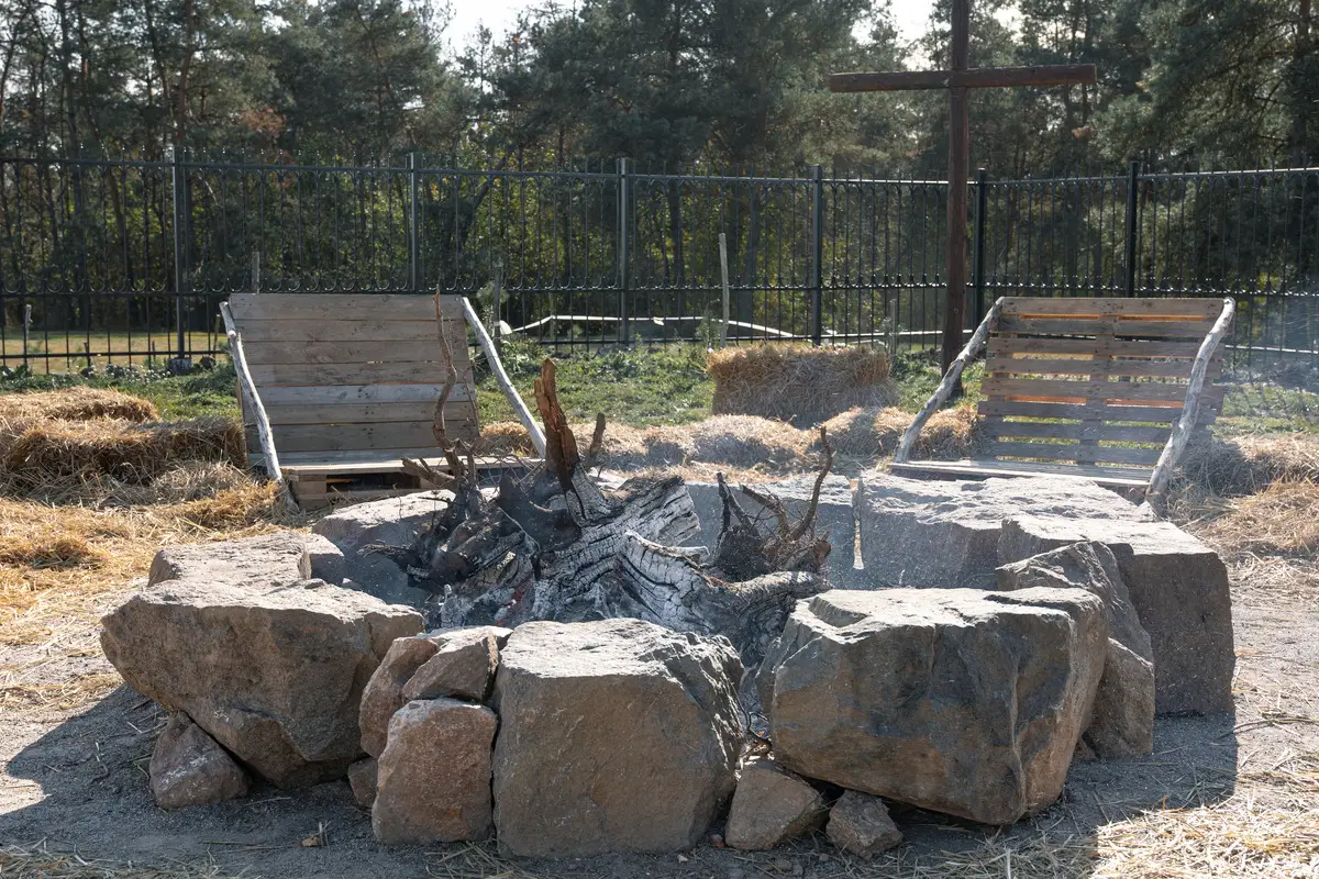 Custom stone fire pit and seating area in Greenville, NC